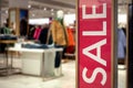 Shopping Sale background. Signage Sale in a clothing store. Royalty Free Stock Photo