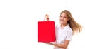 Shopping, sale, christmas and holiday-lovely young girl with red shopping bag,isolated Royalty Free Stock Photo