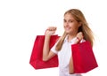 Shopping, sale, christmas and holiday-lovely young girl with red shopping bags,isolated Royalty Free Stock Photo