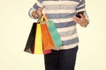 Shopping and Smartphone in hands of buyer. Online shopping with telephone. E-commerce discounts sales