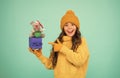 In shopping store. happy new 2020 year. rat symbol of year. small happy girl hold mouse. kid knitted sweater and hat Royalty Free Stock Photo