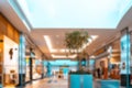 Shopping supermarket blurred background. Interior of retail centre store in soft focus. People shopping in modern commercial mall Royalty Free Stock Photo