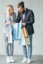 Shopping surprise woman show purchase man bags Royalty Free Stock Photo