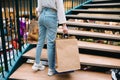 Shopping time, closeup of teenage girl legs with shopping bags at shopping mall Royalty Free Stock Photo