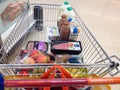 Shopping trolley or cart with food.