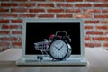 Shopping trolley cart laptop with a clock