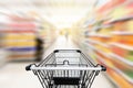 Shopping trolley in department store with consumer goods product Royalty Free Stock Photo