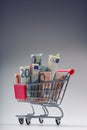 Shopping trolley full of euro money - banknotes - currency. Symbolic example of spending money in shops, or advantageous purchase