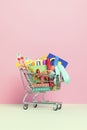 Shopping trolley full of school supplies. Preparation to school, shopping, sale, deals, discounts, promotion