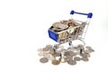 Shopping trolley or Shopping cart full of coins money isolated o Royalty Free Stock Photo