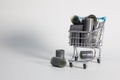 Shopping trolley and tangle of unrolled exposed 35mm film strips Royalty Free Stock Photo