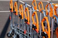 Shopping trolleys lined up at hardware store. Close up