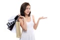 Shopping woman asian happy smiling holding shopping bags isolated on white background Royalty Free Stock Photo