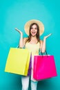 Shopping. Shopping woman excited dynamic image of young woman with shopping bags. on color background.