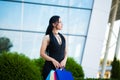 Shopping. Woman holding colored bags near her shooping mall in black friday holiday Royalty Free Stock Photo