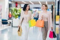 Shopping women talking happy holding shopping bags having fun laughing. Two beautiful young woman girlfriends at mall Royalty Free Stock Photo