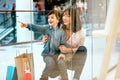 Shopping. Young Mother And Kid With Bags In Mall