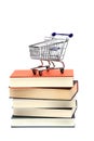 Shoppingcart on top of books