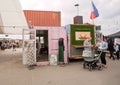 Shops in metal containers and families of customers of the street market Reffen, with street food court Royalty Free Stock Photo