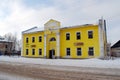 Shops in the old yellow building. Village of Karmanovo of the Smolensk region.