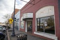 Shops, restaurants, Law offices and various businesses along Veterans Memorial Hwy with parked cars, a red brick sidewalk