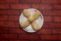 Shor roll Bhog sweet served in plate isolated on background top view of bangladeshi dessert food