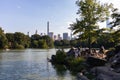 Shore along the Central Park Lake with People and a Midtown Manhattan Skyline View in New York City