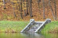 In the autumn pond down the stone old steps