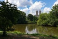 Shore of the Central Park Lake with Green Trees during Summer with a view of the Upper West Side in New York City Royalty Free Stock Photo