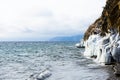 The shore is covered with ice during a storm on Lake Baikal. Royalty Free Stock Photo