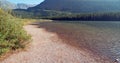 Shore of Fishercap Lake on the Swiftcurrent hiking trail in the Many Glacier region of Glacier National Park in Montana USA Royalty Free Stock Photo