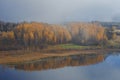 Shore of Gorodischenskoye Lake on a foggy October morning Royalty Free Stock Photo