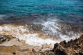 Sea coast on the background of a stone shore with a rising wave Royalty Free Stock Photo