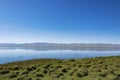 The shore of the lake in the early morning, quiet and windless weather