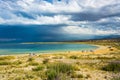 On the shore of Lake Issyk-Kul, Kyrgyzstan. Royalty Free Stock Photo