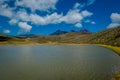 Shore of the lake Limpiopungo located in Cotopaxi national park, Ecuador in a sunny and windy day