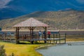 Shore of the lake Limpiopungo located in Cotopaxi national park, Ecuador in a sunny and windy day