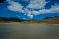 Shore of the lake Limpiopungo located in Cotopaxi national park, Ecuador in a sunny and windy day