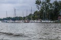 Shore of lake in Poland, near city Ilawa. Yachts and other boats moored at marina Royalty Free Stock Photo