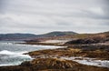 Shore of the northern ocean is made of stones covered with colorful moss. Teriberka, Barents Sea, Murmansk region, Kola Peninsula Royalty Free Stock Photo