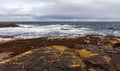 Shore of the northern ocean is made of stones covered with colorful moss. Teriberka, Barents Sea, Murmansk region, Kola Peninsula Royalty Free Stock Photo