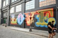 Shoreditch district in East London during Covid 19 lockdown with people wearing masks on the streets