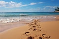 Shoreline imprints, footprints on beach sand narrate tales of ocean rendezvous Royalty Free Stock Photo