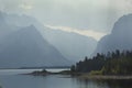 Shoreline of Jackson Lake, sun rays, Jackson Hole, Wyoming. Royalty Free Stock Photo