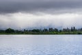 Shoreline lake on a cloudy day, rain pouring in the background, Mountain View, San Francisco bay area, California