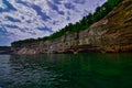 Shoreline reflected in the water Pictured rocks national lakeshore on lake superior Royalty Free Stock Photo
