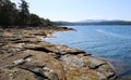 Clear pristine ocean with pebble beach on Vancouver Island in Nanoose park Royalty Free Stock Photo