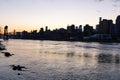 The East River during Sunset with the Roosevelt Island Bridge and Manhattan Skyline in New York City