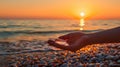 Sunset treasures woman\'s hand holds glass stones from beach, tranquil moment, Ai Generated Royalty Free Stock Photo