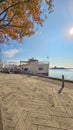 A Shoreline Sightseeing ship named Marlyn docked on the blue waters of Lake Michigan on a cloudy autumn day in Chicago Illinois